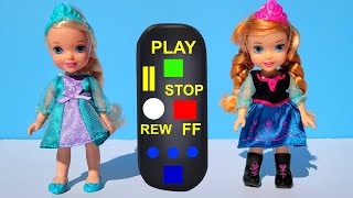 Elsa & Anna toddlers playing jokes with a remote control