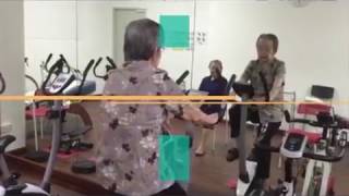 Ageing Senior elderly lower limb rehabilitation and stimulate muscle exercise at Goldencare