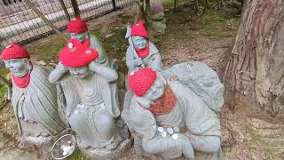 Japan, Miyajima Daisho-in Temple: 500 Rakan statues of Buddhist monks & O Jizo Sama Guardian of kids