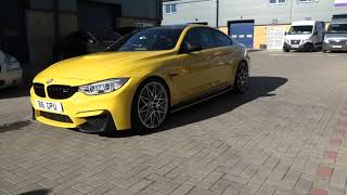 BMW M4 in Porsche speed yellow with Modesta BC08 coating applied.