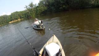 bob catching a catfish from his kayak