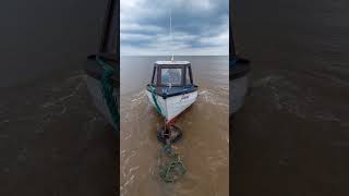 Small boat launching from the beach #fishing