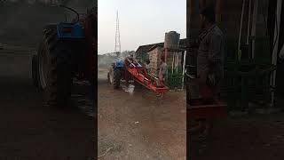 tractor augur washing after piling on the earth