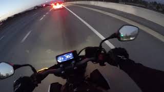 Honda CB650R messing around with a Mustang GT