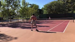 Billy Candelaria and Tim Coy playing tennis