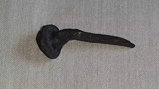 Ancient irregular round head and shank, hammered magnetic wrought iron nail possibly of 1st century