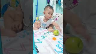 Baby Tries to bite an apple