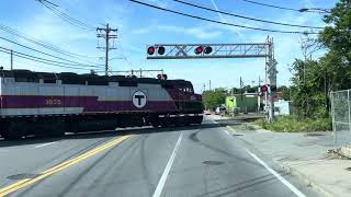 A Passenger Train Passing a Railroad Crossing in Boston