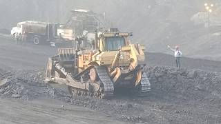 CAT_D11_dozer_at_work_pushing_gravel_for_road_construction