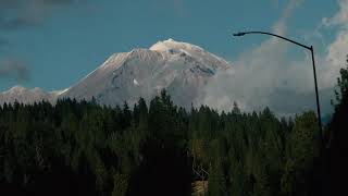 Catching glimpses of Mt Shasta while driving on the freeway