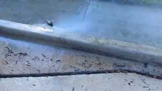 Pressure Washing Turbo Laser nozzle on curb