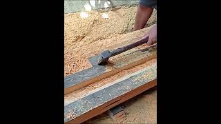 process of cutting cover wood with hand saw skills.