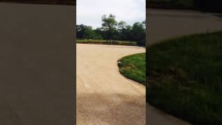 Asphalt Paving and Maintenance installing a Chip and Seal driveway