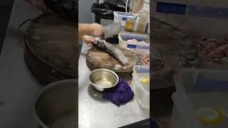 Hold the fish firmly and scrape from tail to head to remove the scales. #cactusfoodies #shorts