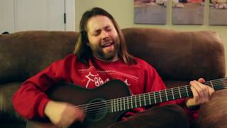 CJ Solar Sings Blue Bandana On The Brown Couch