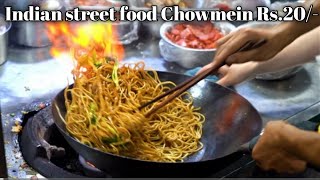 Indian Street Food -Fried noodles with egg fried rice, fried broiler, egg and vegetable pie