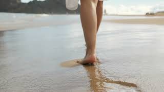 Walking barefoot on the beach