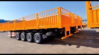 M097 Four Axle Drop Side Fence Semi Trailers In The Yard Ready For Delivery