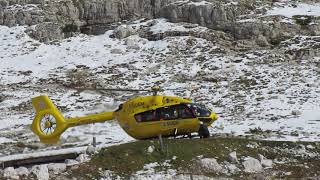 Helicopter lands on the dolomites - Tre Cime Lavaredo - Italy