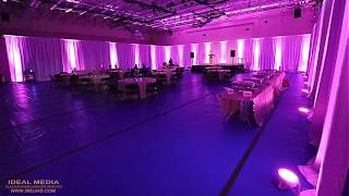 Pipe and Drape with Purple Uplights and Spotlight - Ideal Media DJ & Lighting