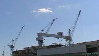 Big gantry crane and 3 big cranes at naval shipyard