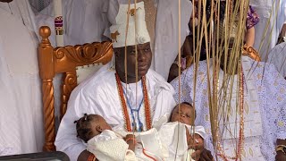 OONI CARRIES HIS TWIN BABIES FOR THE FIRST TIME AT THIER DEDICATION AND TRADITIONAL RIGHT.