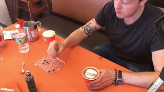 Latte Artist Draws the GNA Logo On An Espresso