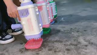 Gatling Bubble Machine，，The kid behind should really want this bubble machine