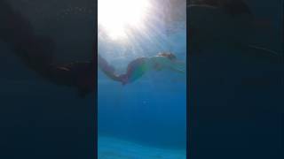 Rainbow mermaid swimming in crystal clear pool #realmermaid #mermaid #mermaidtail