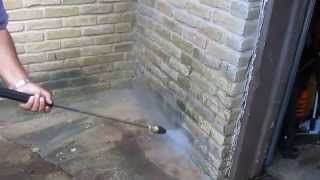 Laser nozzle with electric cold pressure washer on brick