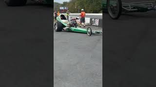 Slingshot dragster going back to the pits Americana drag racing at its finest