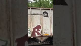 “Retired” Norfolk Southern SD60I and an SD60 eastbound with Conrail Hoppers from 2018.