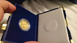 Quarter proof American gold Eagles from the 1990's in original packaging.