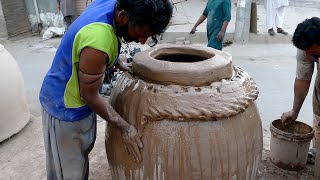 How skilled the poor workers are making large clay oven