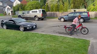 Honda CT110 Towing a Car