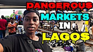 WATCH A TRAIN RUN THROUGH LAGOS MOST DANGEROUS MARKET.