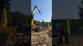 Truck mounted crane handling wooden pile test