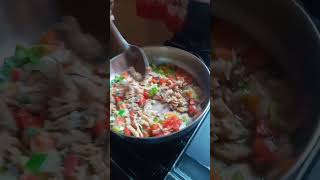 cooking ackee and salt fish along with fry dumpling