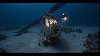 Award Winning Photos Capture Eerie Underwater Scenes of Shipwrecks Rusted Tanks and a Sunken