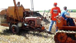 Allis Chalmers hillside combine pulled by an M crawler