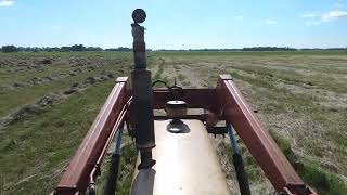 Raking hay with 730 Case and New Holland V rake