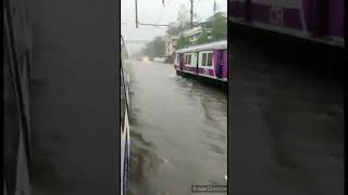 Train running in water Mumbai local railway lines