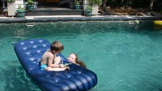 Gabriel and Mel in the pool at Rumah Putih Abu Abu