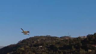 Four firefighter planes taking water from Douro river