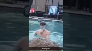 kid swimming wearing a mask