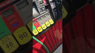 Tesla Model X at a gas pump