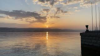 Beautiful sunset on cozy city beach