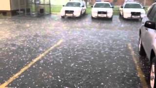 Hail drops on patrol cars at La Marque police station