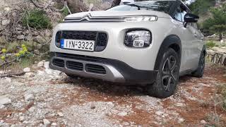 Citroen C3 Aircross (no grip control) in uphill dirt road with deep potholes seesaw