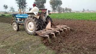 Modified Ford 3610 with cultivator in field